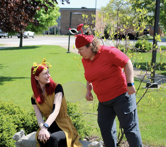 The Crabby Librarian hovering over Bailey Bee.